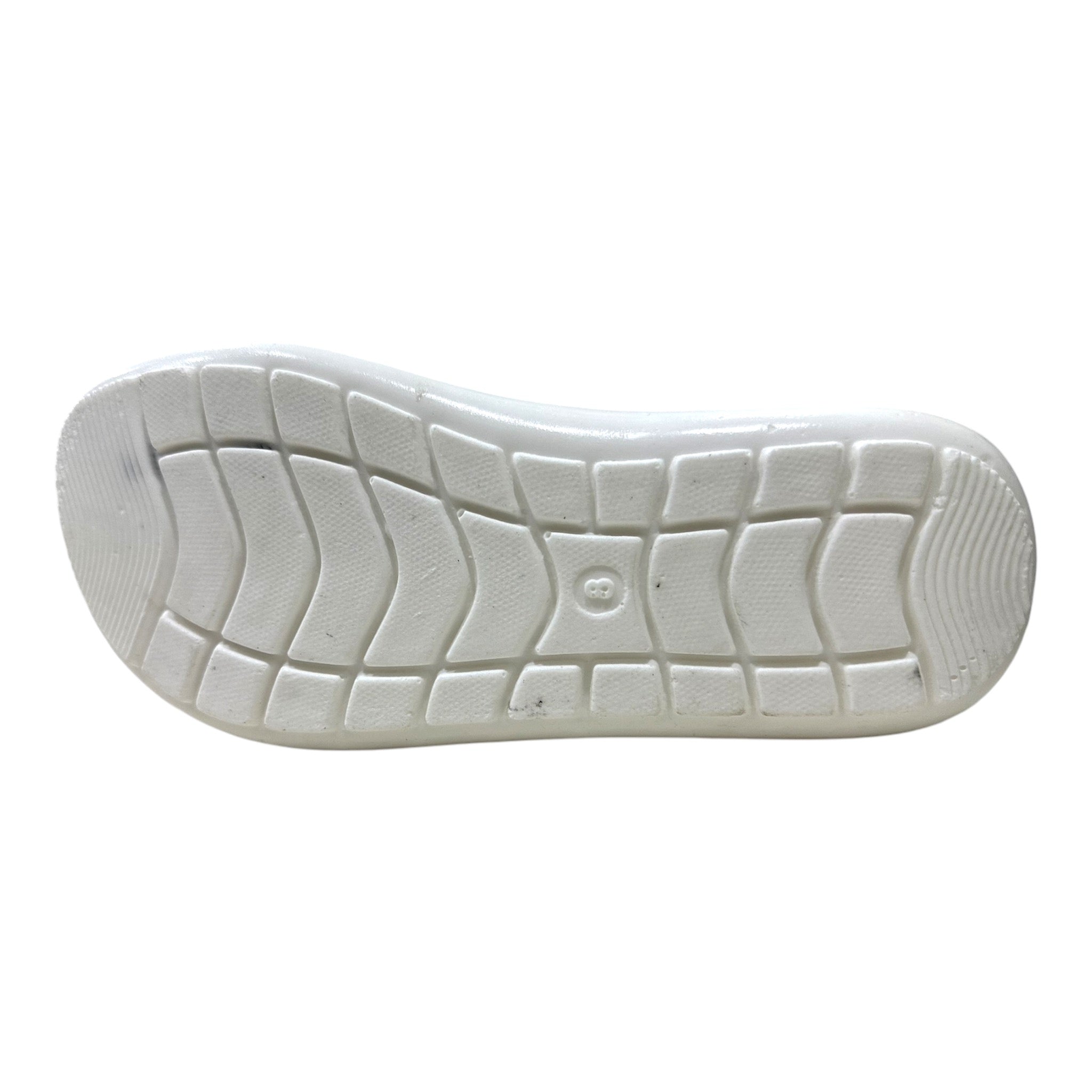 Men Everyday Slides - A12 4 Non-slip rubber outsole of a black slide showing a high-traction tread pattern for safety on wet surfaces.