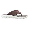 Profile of dark brown athletic slides featuring a thick cushioned midsole and ergonomic arch support for all-day relief.