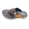 Non-slip rubber outsole of a dark brown slide with a high-traction tread pattern for grip on wet and dry surfaces.