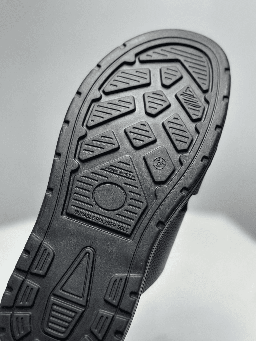 Handmade men's slippers close up showing customizable logo option and 2.5mm PU Rexine upper Nova Footwear